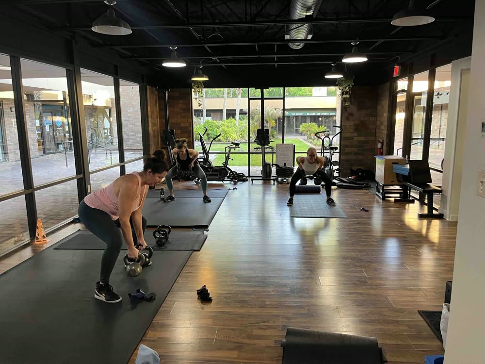 Members working through a circuit on the gym floor