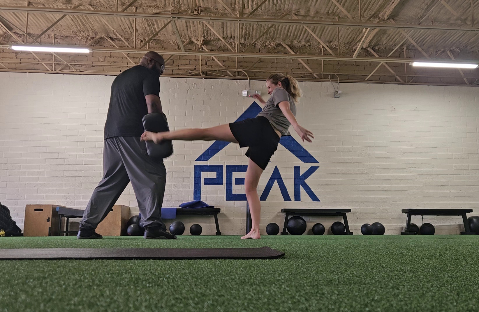 Training on the mats at Peak Martial Arts